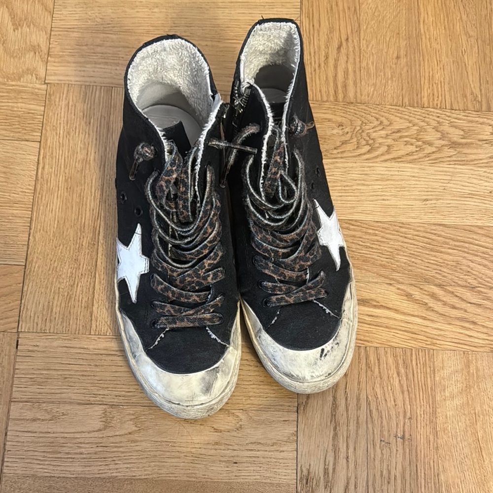 Black High-Top Golden Goose Sneakers with cheetah laces